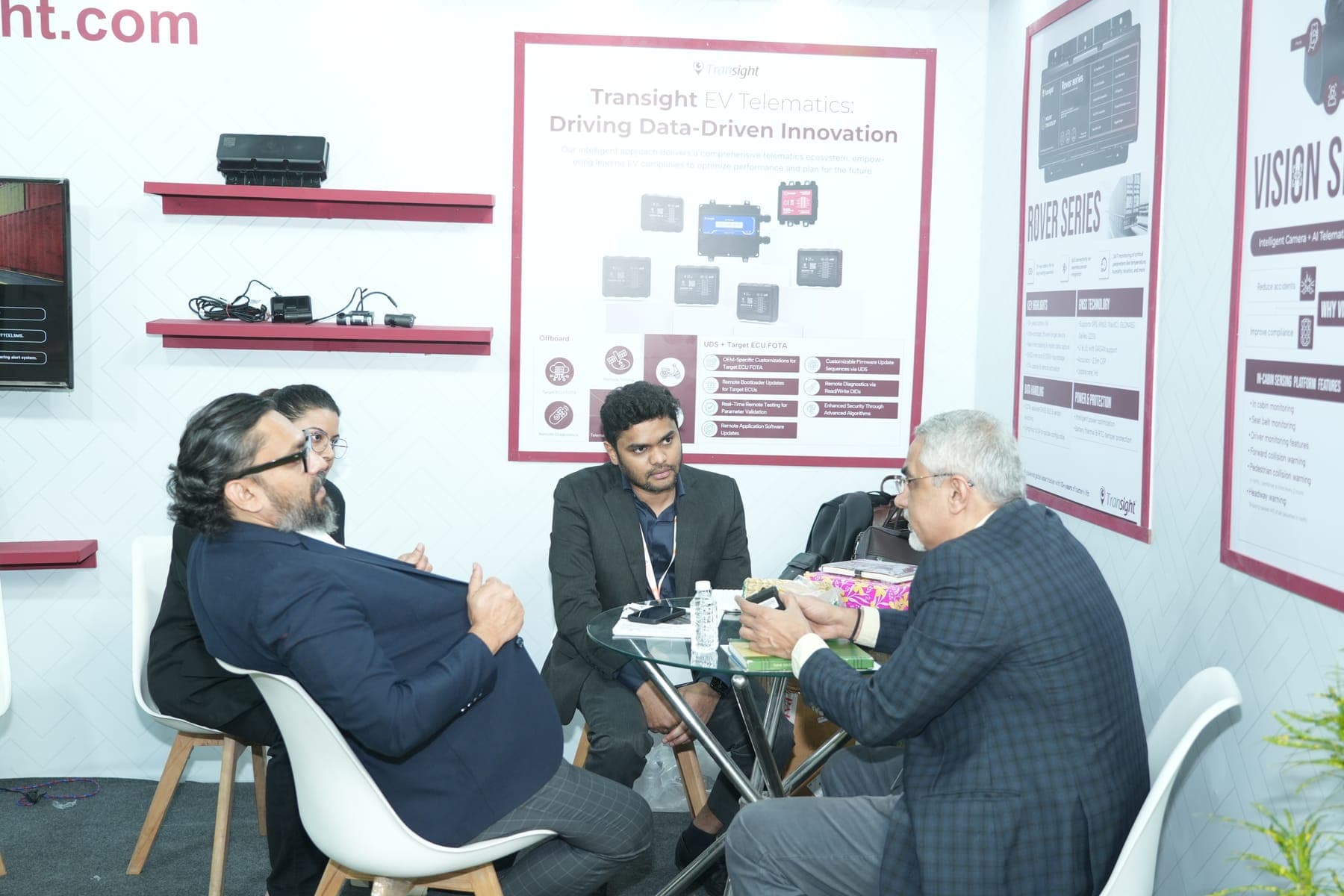 Exhibitors and visitors in a business discussion at a previous edition