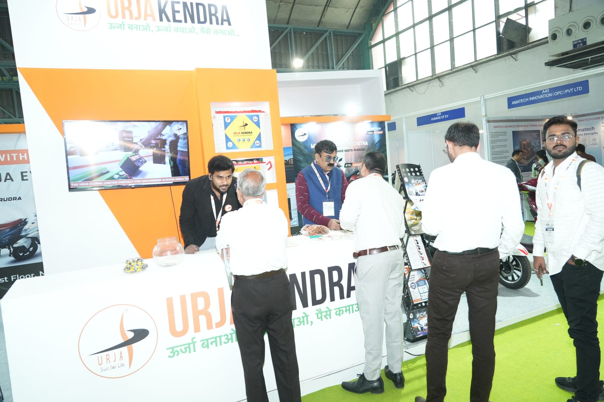 Visitors at an electric-vehicle exhibitor booth at a previous edition of the co-located India International EV Show