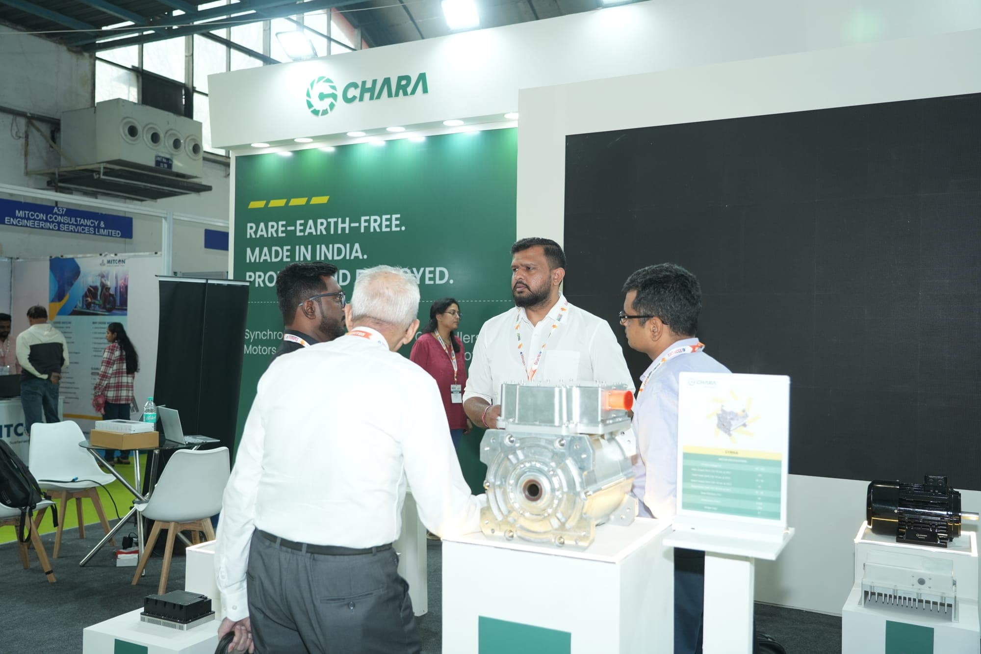 An exhibitor demonstrating rare-earth-free motor technology to visitors at a previous edition